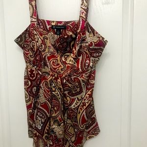 Warm jewel tone colors of Oxblood, tan and gold